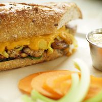 Tempeh Reuben with Turmeric Kraut and Housemade Roasted Onion and Caramelized Onion Sauce at The Stand Vegan Cafe in Fairfield