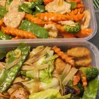 Top: Raad Naa with vegan chicken. Bottom: Dark Soy noodles with tofu. at Kay's Kitchen in Thornton-cleveleys