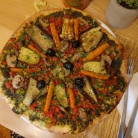 One of the best vegan pizzas I've ever had. The base is a light and simple basil, garlic and coriander pesto. Delicious 😋 at Veggie Pause  in Fes