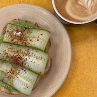 Avocado toast with oat latte  at Avalon - Woodward Ave in Detroit