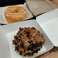 Nutella donut at the back and caramel chocolate cake donut at the front at Donut Friend - DTLA in Los Angeles