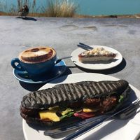 Amazing view, lovely latte art, delicious coconut cake and tasty falafel baguette. All vegan ❤️ at Astro Cafe in Lake Tekapo