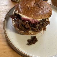 Brisket brioche with caramelize onions, sauerkraut, gherkins, and horseradish mayo  at WAVE in East London