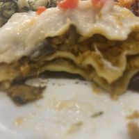 The inside of the weird cornbread lasagna .  I wouldn’t necessarily seek this out, but this wasn’t exactly bad either. I’d eat it again   at Jardim das Cerejas - Chiado in Lisbon