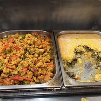 The plates in heaters.  The left one was really good.  The cornbread lasagna on right   at Jardim das Cerejas - Chiado in Lisbon