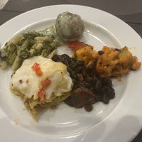Meatball with gravy, some lasagna looking thing that tasted like cornbread between noodles, noodles with greens, something else, black beans  at Jardim das Cerejas - Chiado in Lisbon