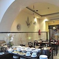 Bountiful buffet with a colorful array of salads, veggies, indian fritters and poppadom on a quiet, rainy Sunday night in Lisbon. at Jardim das Cerejas - Chiado in Lisbon