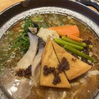 The presentation with a bit of miso on top   at Takesan Ramen - Obuse in Nagano