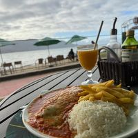 Zucchini cover with cheese and tomato sauce with potato chips, rice and beans. Lots of food! at Pimenta de Cheiro in Sao Paulo