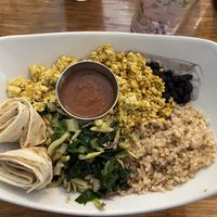 The breakfast bowl: eggy-spiced, chopped, super firm tofu, black beans, brown rice, sautéed greens, flour tortilla, and salsa.  at Palm Greens Cafe in Palm Springs