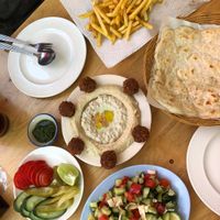 Hummus, baba ganoush, pickles, falafel, salad, flatbread, fries at Sababa in Chiang Mai