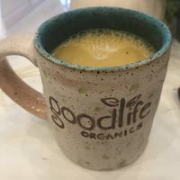 Golden Milk made with banana milk. So warm and delicious. Made with turmeric, ginger, maca, goji Berry, frankincense, cardamom, and black pepper. at Good Life Organics in Shillington