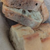 Two types of complimentary bread at Le Potager de Charlotte - Rennequin in Paris
