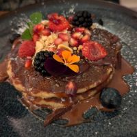 Almond & Rice Pancakes dessert (hazelnut cacao cream, hazelnuts, fresh fruits and agave at Le Potager de Charlotte - Rennequin in Paris