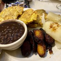 Black beans, fried plantain, yuca and tostones. Comes with rice.  at Columbia in St Augustine