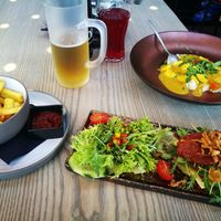 Tex-Mex burger and Alpencurry. Fries ordered separately. at Tom Almhütte in Maria Alm