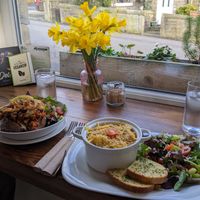 Vegan dishes and beautiful daffodils in January! at Pixie Bakes Cakery and Coffee Shop in Tintwistle