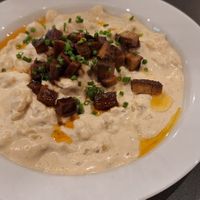 Potato dumplings with vegan cheese + vegan bacon at Made with Laf in Bratislava