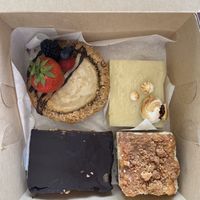 vanilla cheesecake, lemon bar, chocolate peanut butter bar, coffee cake  at Hazel & Jade Bakery in San Diego