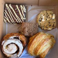 Peanut butter brownie, marshmallow peanut butter chocolate chip cookie, breakfast croissant, coffee cake, and cinnamon roll.  at Hazel & Jade Bakery in San Diego