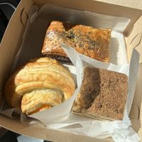 Breakfast croissant (sausage cheese and potatoes), sausage roll, and coffee cake  at Hazel & Jade Bakery in San Diego