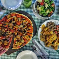 Vegan pizza, seitan salad, nachos  at Coffee Temple in Varkala