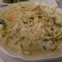 Super thick green curry with tofu. It has peas in it and lots of cabbage. HUGE portion.  at Blue Orchid in Lincoln