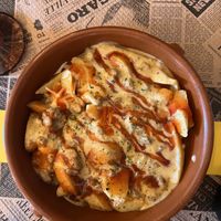 Potatoes Con Salsa de Quesa Ala Pimientas  at La Factoría Vegana in Leon