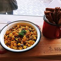 Scrambled tofu with homemade breadsticks at Manjerica in Lisbon