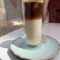 Iced latte macchiato with oat milk   at Manjerica in Lisbon