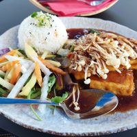 Ikone Enoki: tofu steak, enoki mushrooms, soy sauce, cilantro greens, jasmine rice (14.90) at Tam Tam in Dusseldorf