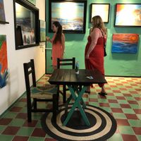 You can wander the art galleries with a drink while waiting for your food  at Qulture in Puerto Vallarta