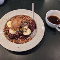 Acai bowl with peanut butter and a brew coffee at Pom & Flora in Stockholm