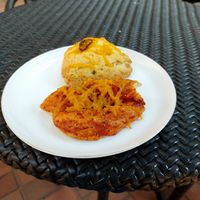 Pizza and Jalapeño cheddar scone. at Bonus Bakery in Vancouver