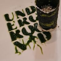 Sweet spinach cannoli stuffed with coconut cream and green peas, topped with pistachios. Mysterious but delicious green sauce at Antonio Chiodi Latini in Turin
