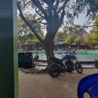 View from location. Parking is across the pool. at Shwe Moe Thu in Hpa-an