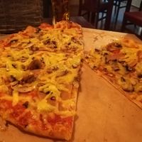 Salami pizza with mushrooms  at Vegan Pub in Bratislava