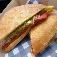 Toastie with pesto, capsicum and spicy vegan pepperoni at Little Mylkbar in Parkville