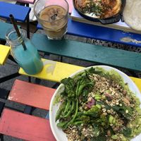 Green Garden salad, Shakshuka w/naan, spirulina&ginger lemonade, ice coffee at Nola Kitchen in Porto