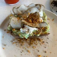 Avo toast (vegan) with macadamia ricotta  at Nola Kitchen in Porto