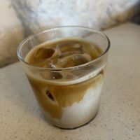 Ice coffee latte with oat milk and cardamom  at Nola Kitchen in Porto