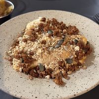 Cauliflower with “cheese” and crunchy soy crumbles  at Nola Kitchen in Porto