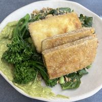 Green salad bowl with crispy tofuu  at Nola Kitchen in Porto