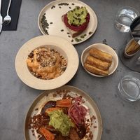 Avocado on toast without feta, cauliflower cheese, tofu, sweet potato wedges   at Nola Kitchen in Porto