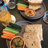 Roasted red pepper hummus and sundried tomato pesto with sourdough and veggie sticks  at Nola Kitchen in Porto