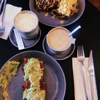 Tostadas de shiitake, huevos revueltos, tomate y pesto, y de aguacate, boniato y remolacha at Nola Kitchen in Porto