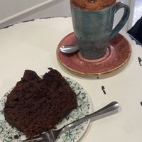 Vegan chocolate and avocado cake (perfect level of sweetness) and capuccino with oat milk   at Velvet Bakery in Vitoria Gasteiz