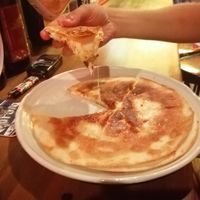Mexican cheese pizza - Japan style (served with sweet-sour sauce) and its lightly spicy
Very yummy if you are a vegetarian who loves cheese.  at Osaka Tacos in Osaka