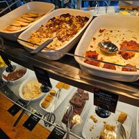 Dessert / sweet section: pancakes, rhubarb crumble, cakes, brownies, creams at Tibits in Darmstadt