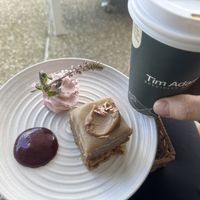 Vegan macadamia slice with strawberry coolie and whipped strawberry Chockie cream.  at Gather and Feast in Caboolture